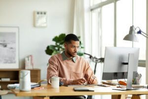 Access to Work for ADHD and autism — person working with workplace support in the UK